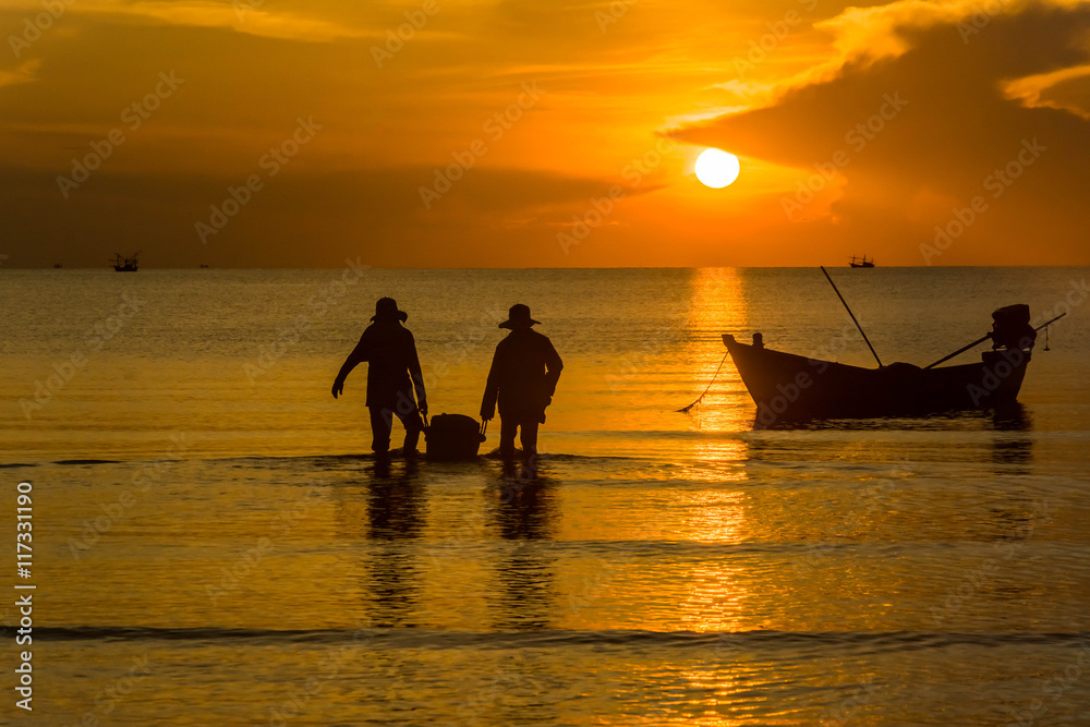 Silhouette of fishing and fisherman boat at the Sunrise in thailand