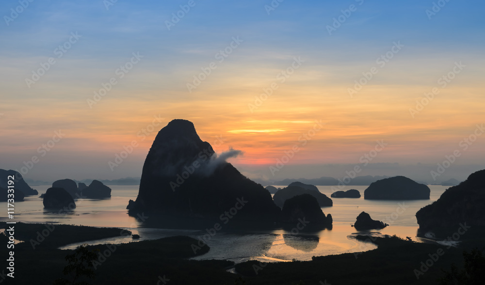 Silhouette of imestone karsts lanscape in Phang nga bay at sunrise in Thailand