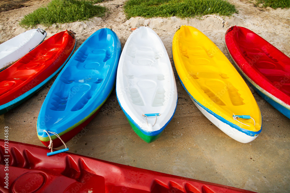 Colourful sea kayaks on the beach.Thailand Colourful sea kayaks on the beach.Thailand