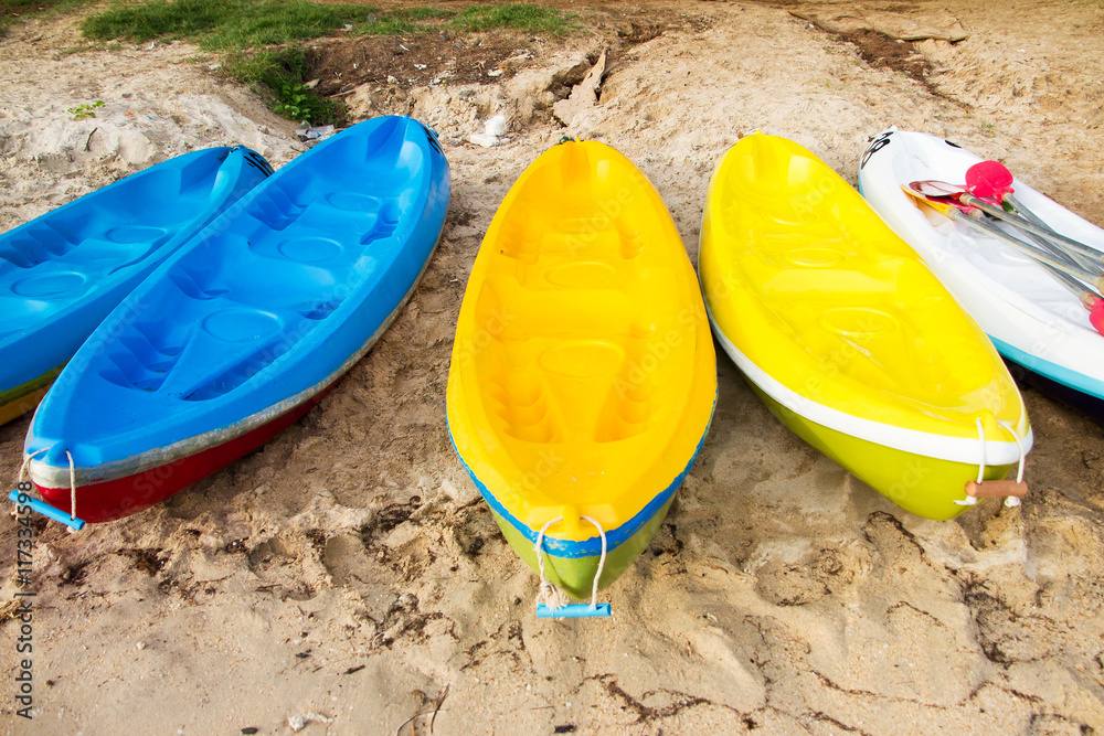 Colourful sea kayaks on the beach.Thailand Colourful sea kayaks on the beach.Thailand
