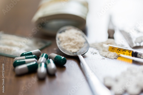 close up of drugs, money, spoon and syringe photo