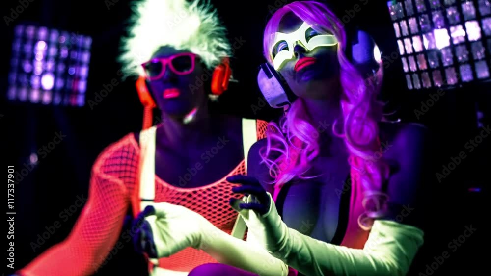 cyber raver couple in fluorescent UV glow cyber raver couple in fluorescent UV glow