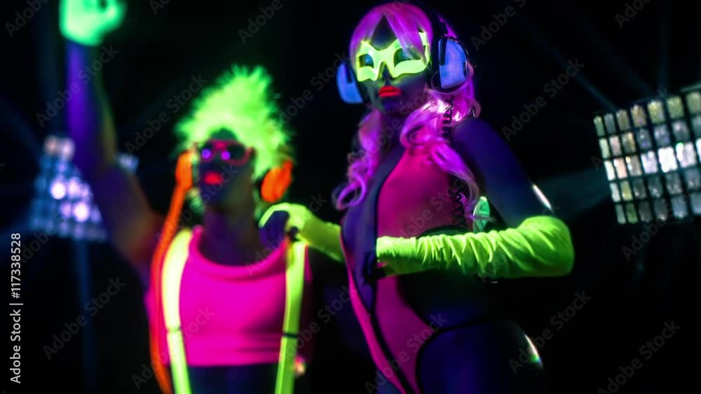 cyber raver couple in fluorescent UV glow cyber raver couple in fluorescent UV glow