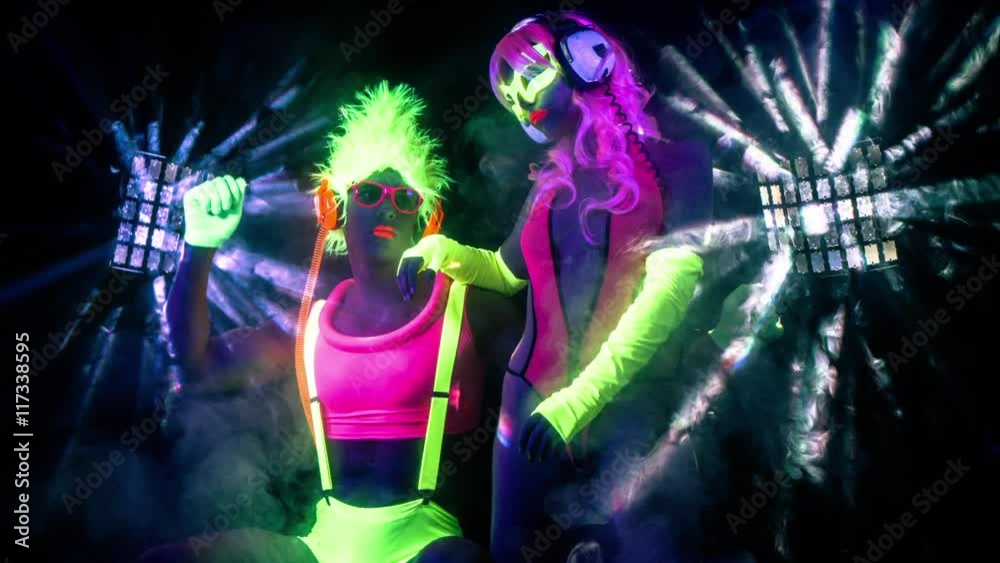 cyber raver couple in fluorescent UV glow cyber raver couple in fluorescent UV glow