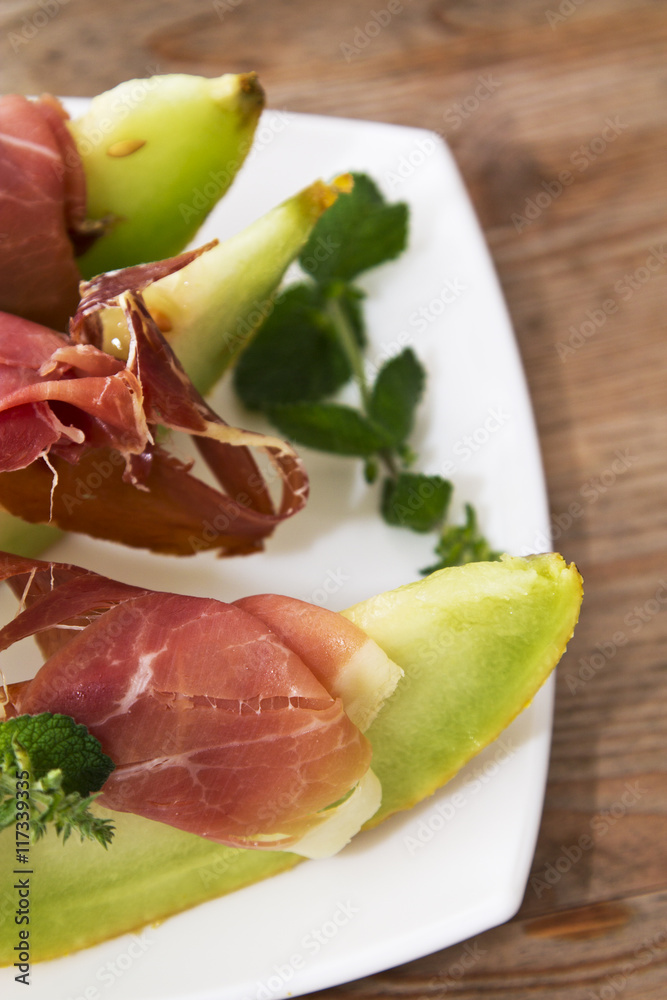 Concept of spanish food with melon and prosciutto. Concept of spanish food with melon and prosciutto.