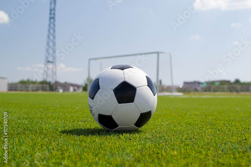 Soccer ball on the stadium with a gate © StockBox