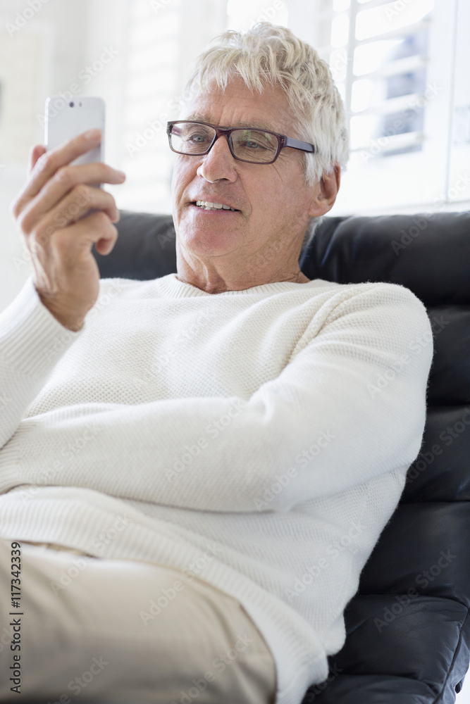 Happy senior man using a mobile phone Happy senior man using a mobile phone