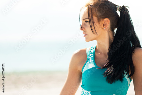 portrait of a beautiful young sexy brunette on the beach