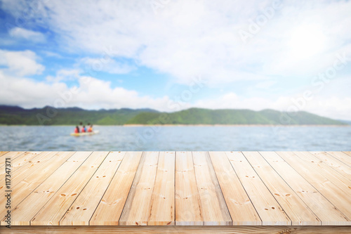 Wood floor with sea and blurred soft light background