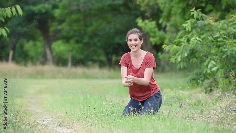 Woman playing with throwing ball to dog Woman playing with throwing ball to dog