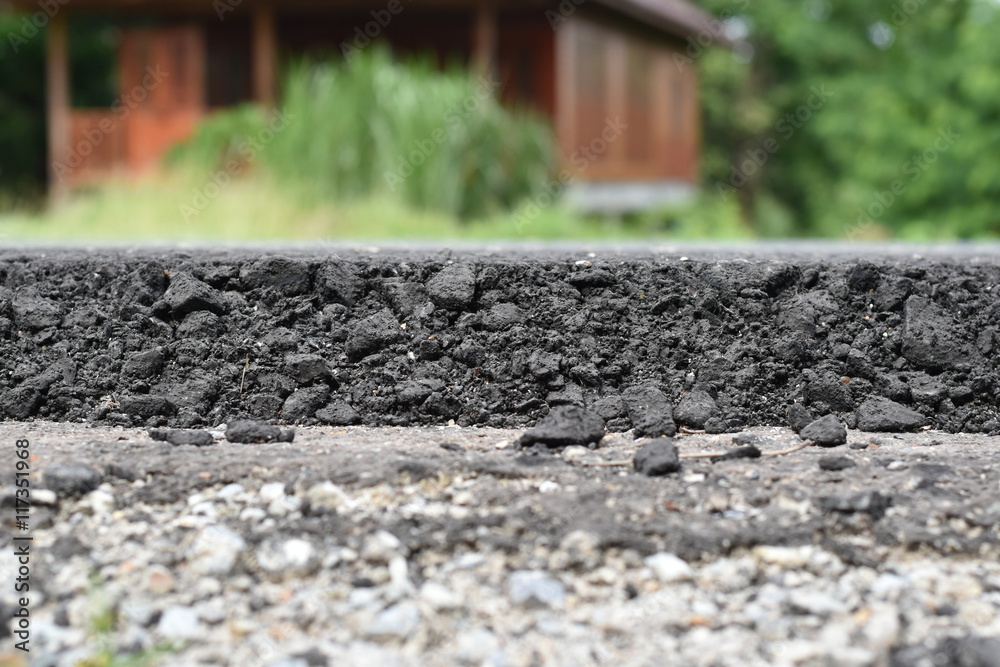 Cross section of asphalt road (top layer is an asphalt and bottom layer is an crushed rock ) Cross section of asphalt road (top layer is an asphalt and bottom layer is an crushed rock )