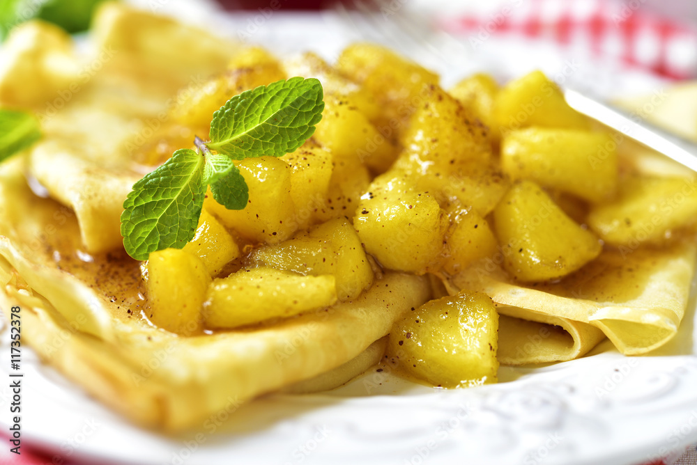Thin pancakes with caramelised apples and cinnamon. Thin pancakes with caramelised apples and cinnamon.