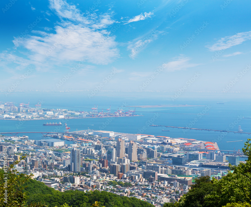 Kobe cityscape and skyline with port view from mountain.