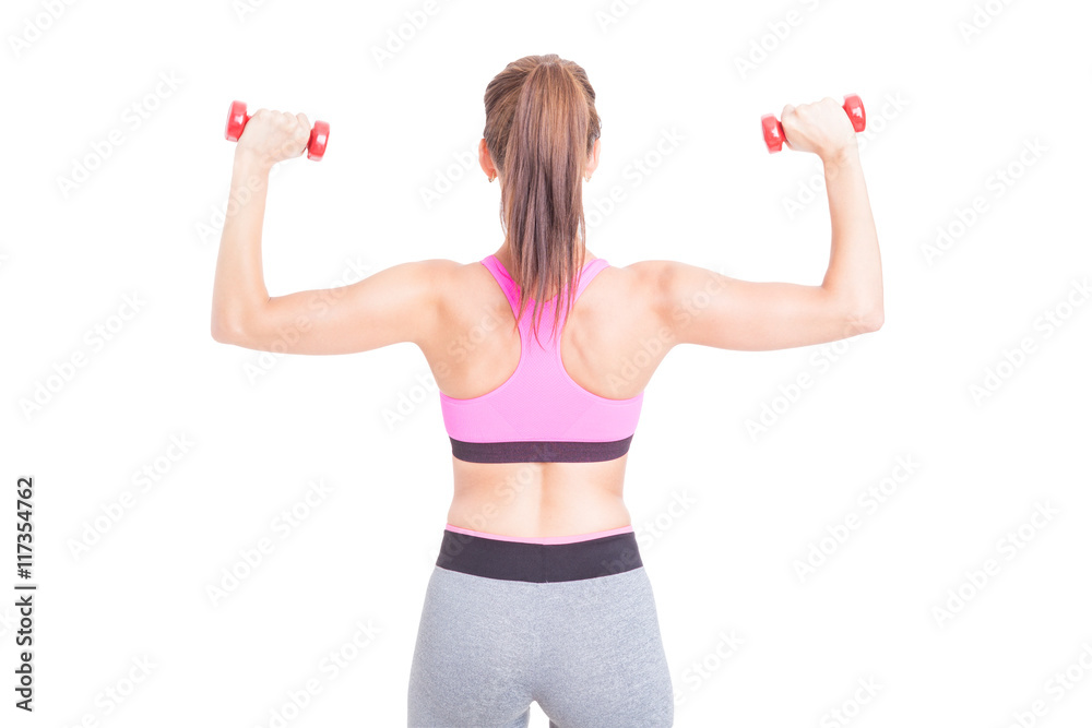 Back view of woman lifting pair of dumbbells Back view of woman lifting pair of dumbbells