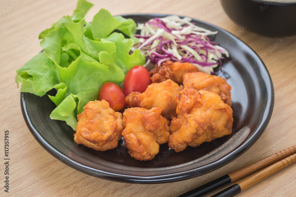 Fried chicken with vegetables on plate, Japanese style