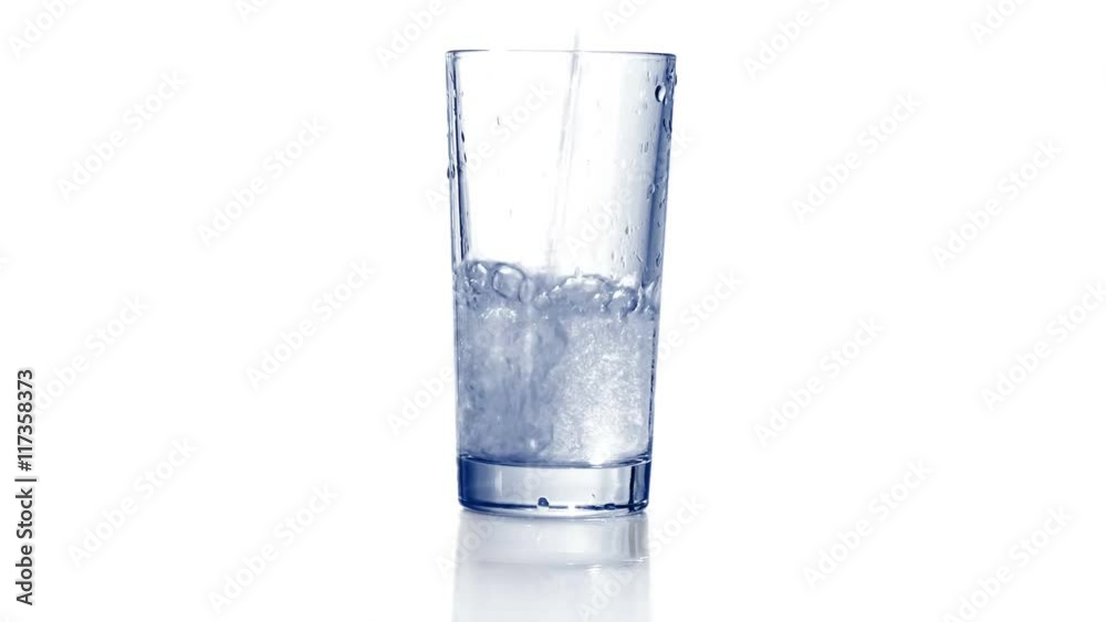 Filling empty glass with carbonated water, dropping ice cubes. Bubbles come out. Close up, extreme close up. 4K Ultra HD.
Filling empty glass with carbonated water, dropping ice cubes. Bubbles come out. Close up, extreme close up. 4K Ultra HD.