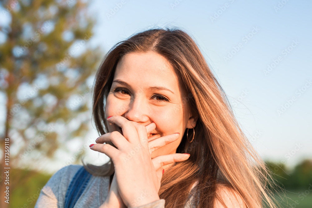 Surprised young woman with hands over her mouth outdoor Surprised young woman with hands over her mouth outdoor