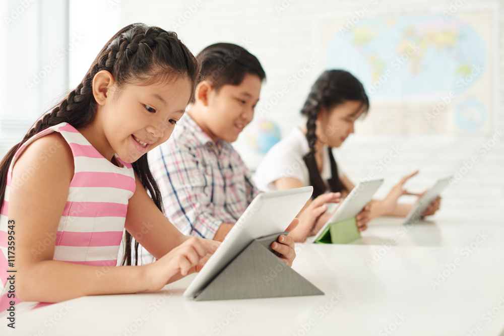 Excited girl using application on tablet computer Excited girl using application on tablet computer