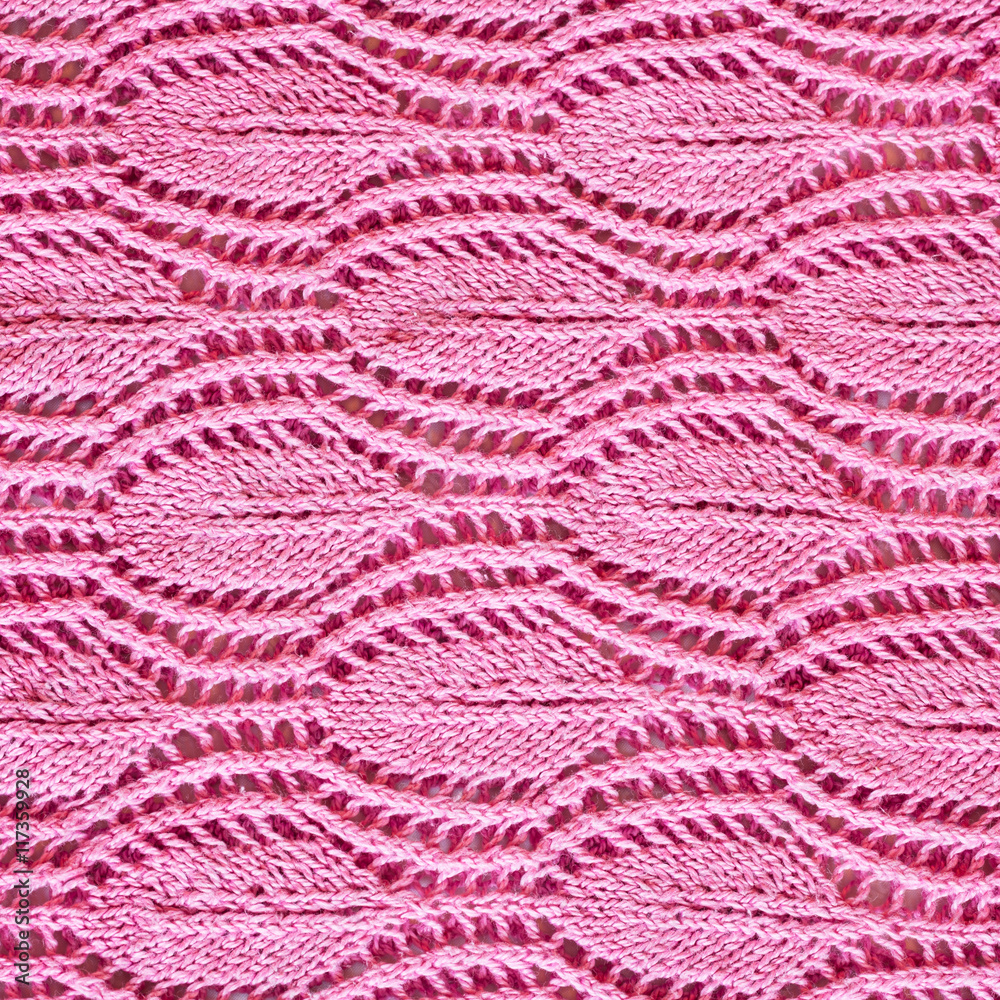 hand-knitted pink pattern close up