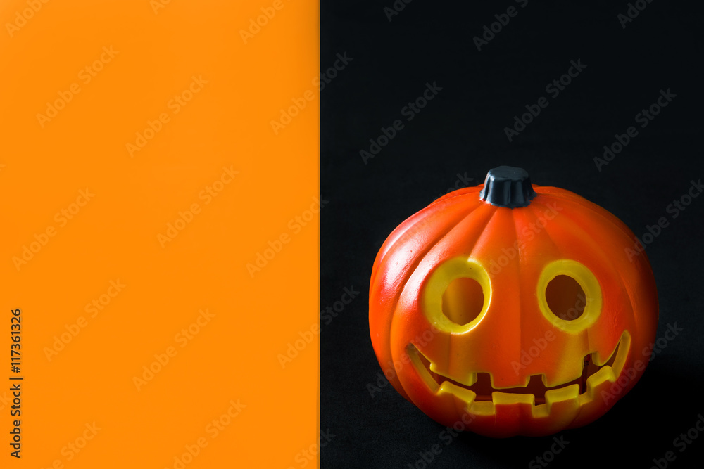 Halloween pumpkin on black and orange background

