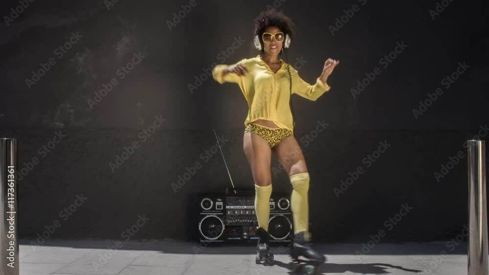 cool roller skating woman dances and skates
