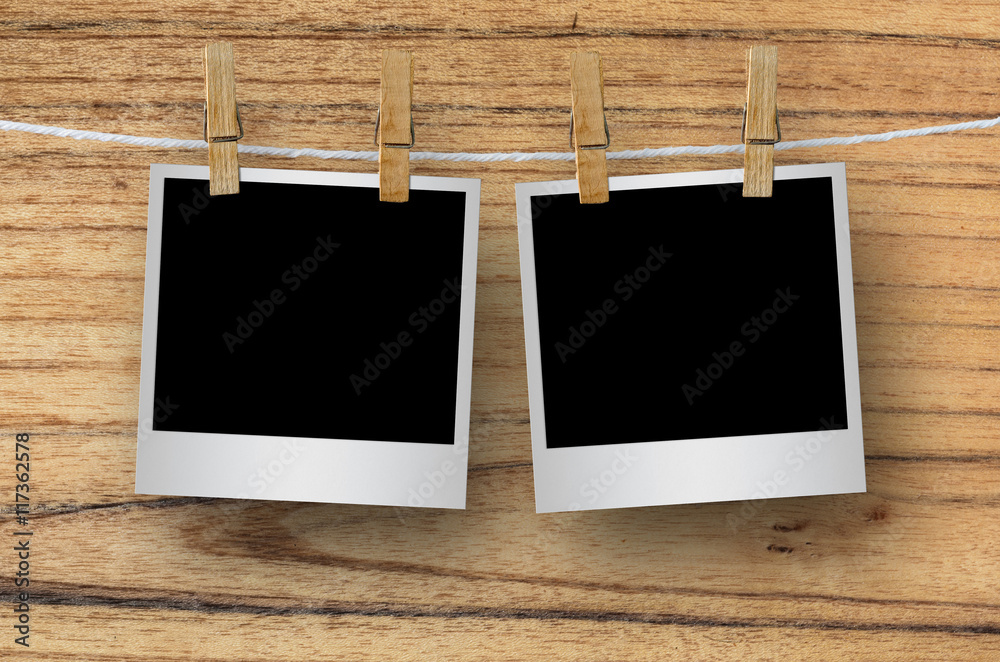 Blank photo frame with clothespin hanging. Blank photo frame with clothespin hanging.