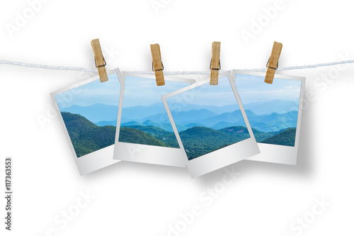 Clothespin hanging with photo mountians, isolated.