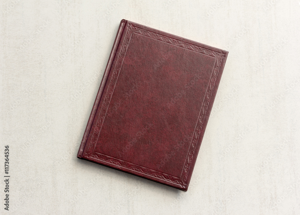 Obraz premium book red on a grey background, top view
