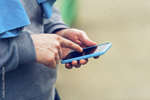 Man holding smartphone.