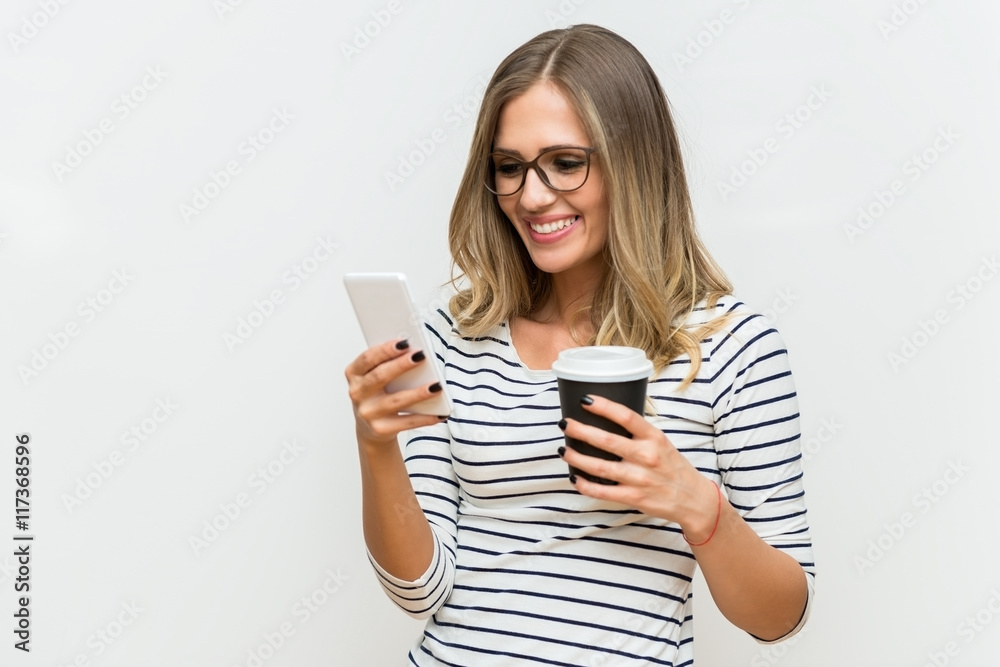 Smiling woman looking at mobile phone Smiling woman looking at mobile phone
