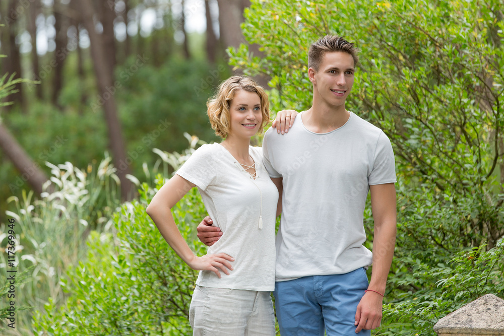 young happy couple walking in the park young happy couple walking in the park