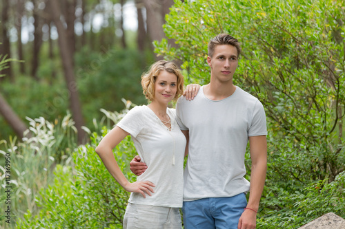 young happy couple walking in the park