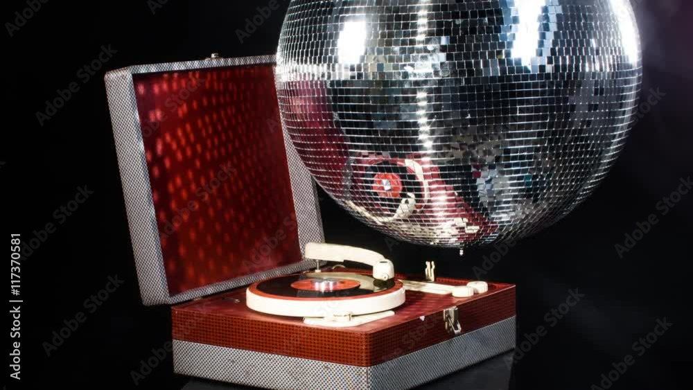 vintage record player with disco ball spinning