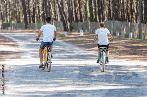young couple bicycling