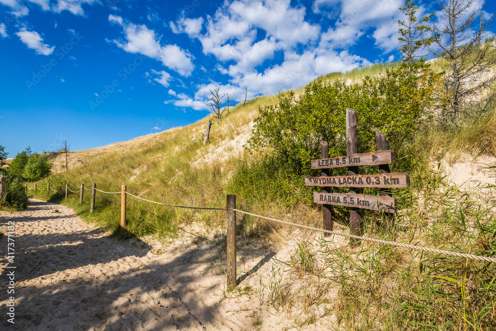 Sand dune tourist trail sign wooden gate to Wydma Lacka - Slowi