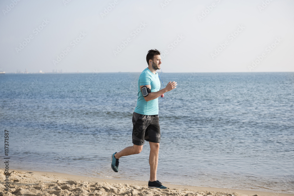 Man jogging close to the sea