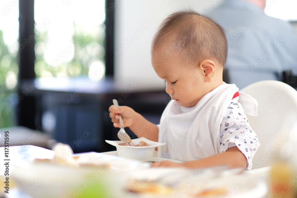 baby boy eating ice cream and Playing smartphone. baby boy eating ice cream and Playing smartphone.