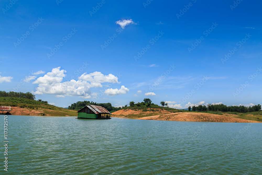 View  riverside with blue sky,clouds and raft in countryside