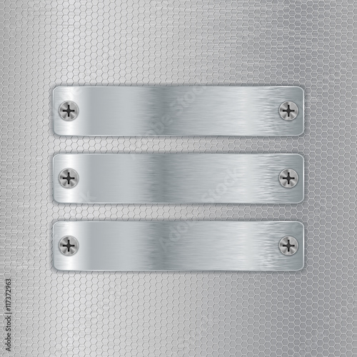 Metal plates screwed to perforated background