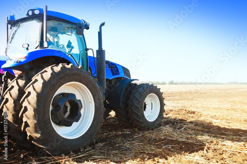 Blue tractor in a field