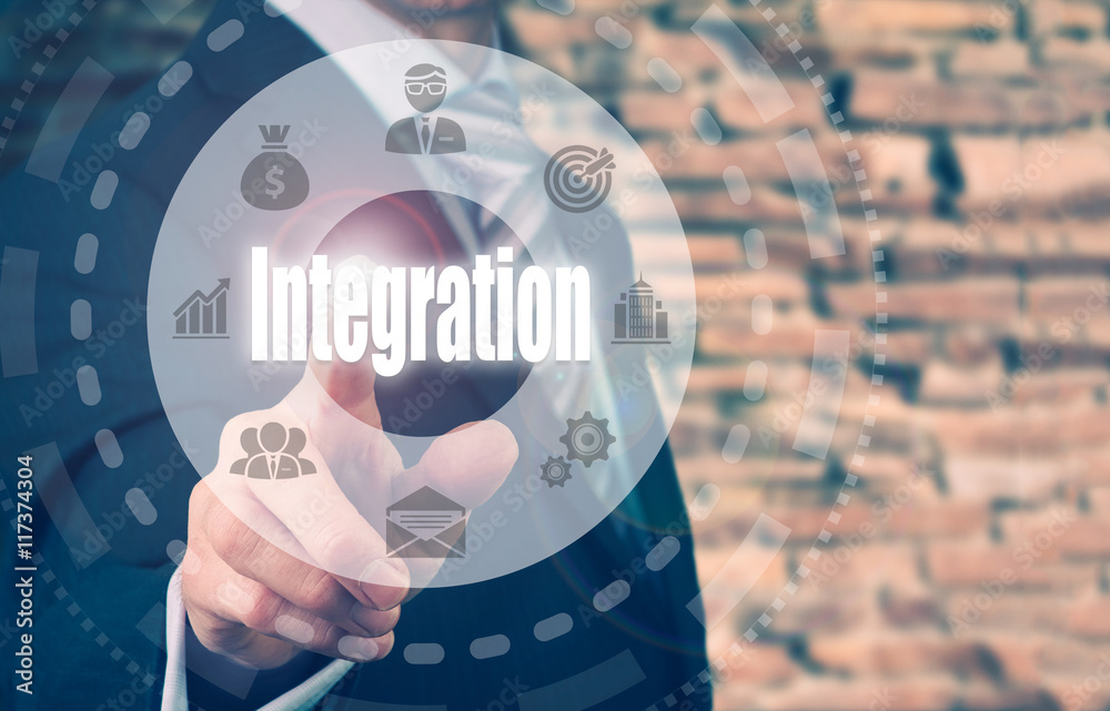 A businessman selecting a Integration Concept button on a circular panel