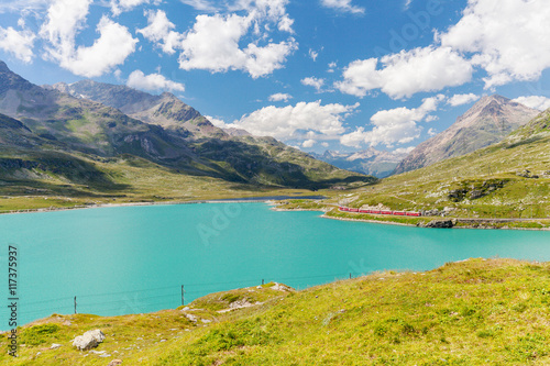 Passo del Bernina - Svizzera - Trenino Rosso sulle sponde del Lago Bianco photo