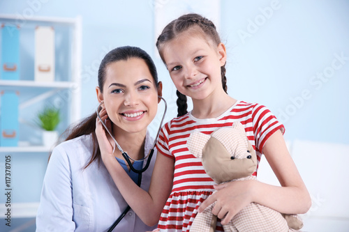 Cute girl visiting a doctor