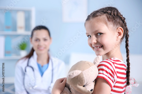 Cute girl visiting a doctor