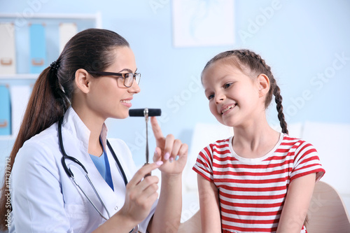Cute girl visiting doctor