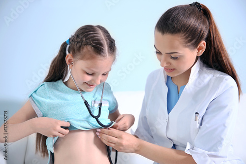 Cute girl visiting doctor
