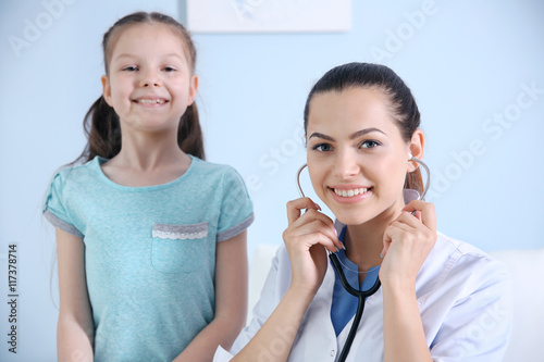 Cute girl visiting a doctor