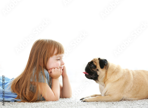Cute girl playing with dog ...