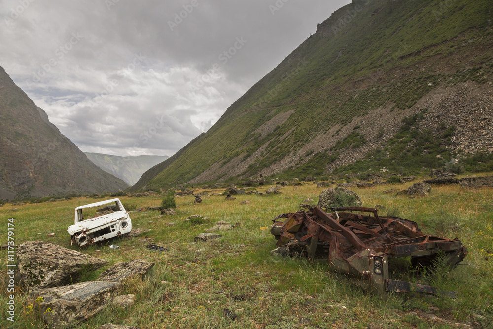 Broken cars near the pass Katu-Yaryk in the Altai Republic, Russ Broken cars near the pass Katu-Yaryk in the Altai Republic, Russ