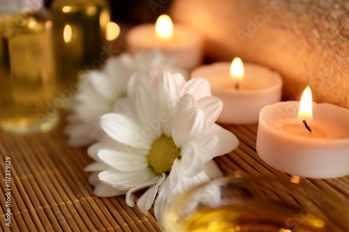 Beautiful spa set with flowers on table